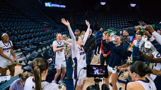 Doogan celebrating with team after win over Davidson