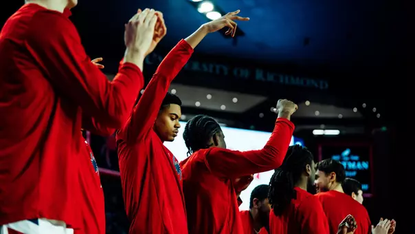 Men's Basketball bench celebration