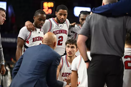 Spiders listen to Coach David Boyden during a timeout