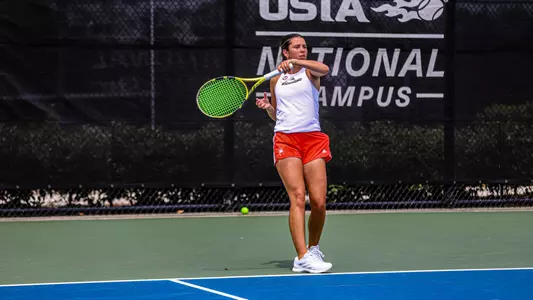 Abby Lee returning a serve