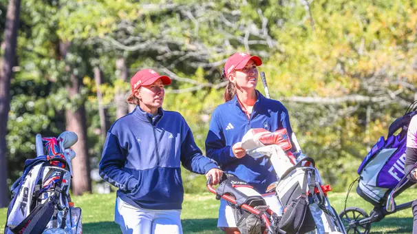 Calle Barlow and Katie Magner track a tee shot