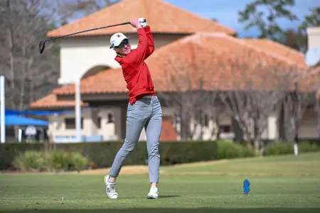 Addie Doroh holds her follow through after a drive