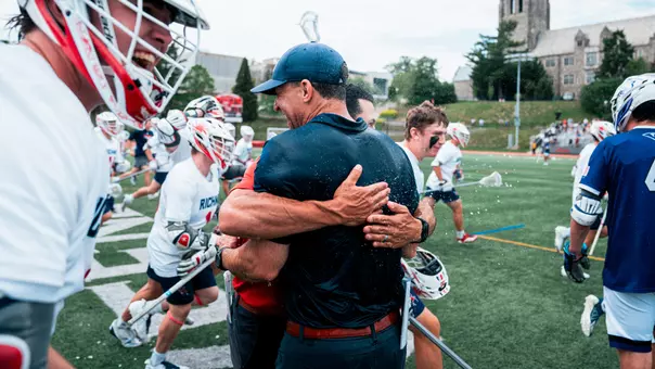 Coach Dan Chemotti embraces Coach Paul Richards after Richmond's 2025 Atlantic 10 Tournament title win