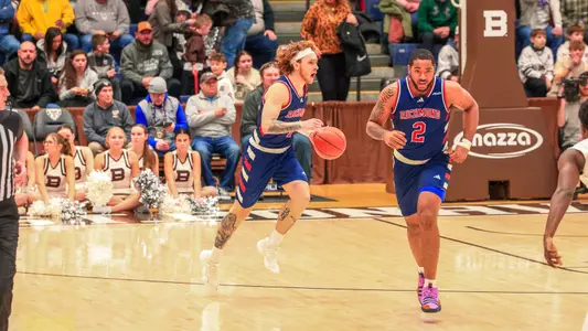 Will Johnston screams out the offense while dribbling up the court