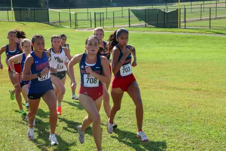 Three Spiders climb a small hill at the Spider Alumni Open