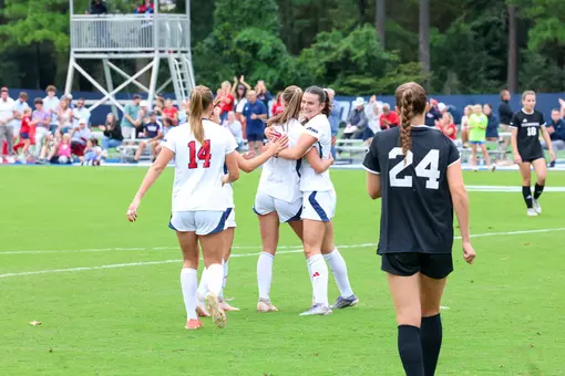 Emma Newman hugs a teammate following a goal