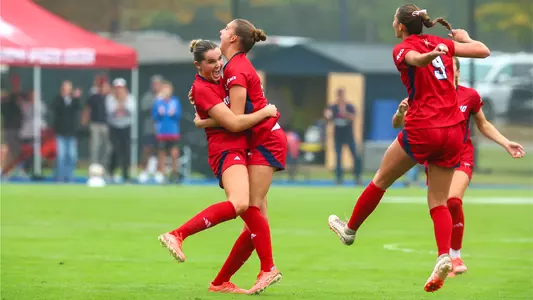 Jess Moylan celebrates a goal with her teammates against Davidson on Oct. 11, 2026
