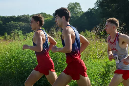 Two Spider runners sprint on the course