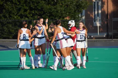 Spider field hockey breaks the pregame huddle against Delaware