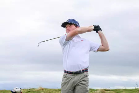Quin Polin holds a high follow-through after a tee shot