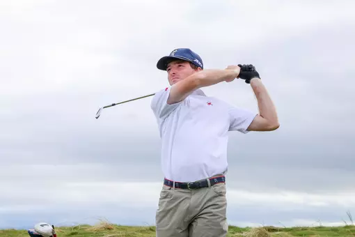 Quin Polin holds a high follow-through after a tee shot