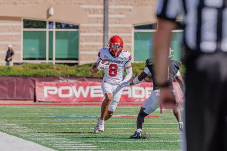 Bryce Allen looks to run past a defender against Lafayette on Oct. 3, 2026