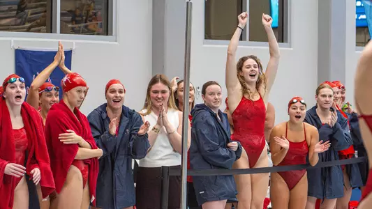 Swimming and Diving team cheering for a teammate