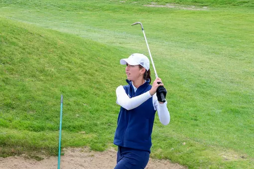 Katie Magner chips out of a bunker