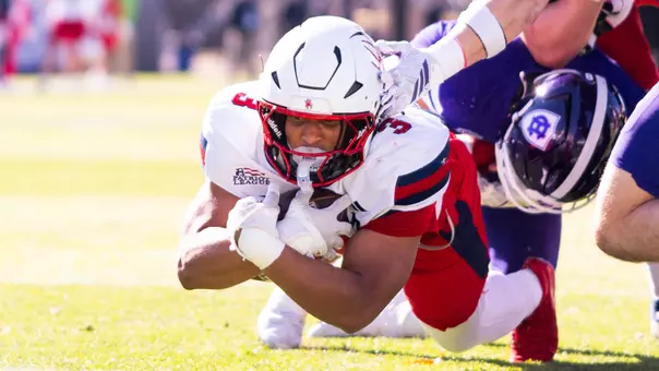 Aziz Foster-Powell punches in a touchdown run against Holy Cross on Oct. 31, 2026