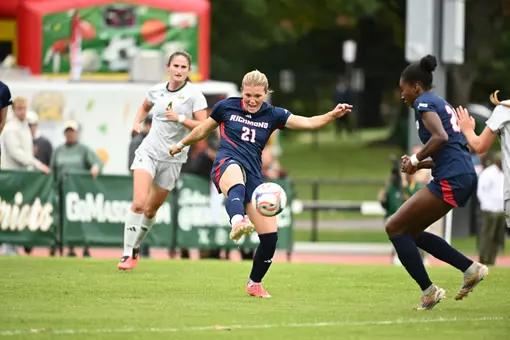 Gwen Howell clears the ball