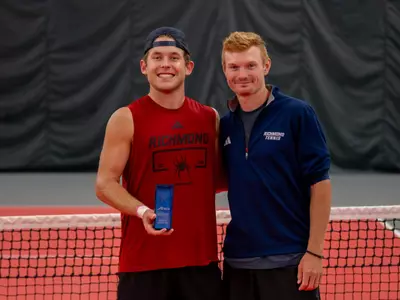 Men's Tennis' Charlie Burdell and AC Jacob Dunbar at the A10 Masters Tournament