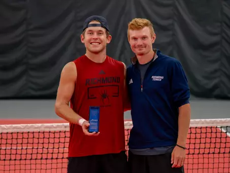 Men's Tennis' Charlie Burdell and AC Jacob Dunbar at the A10 Masters Tournament