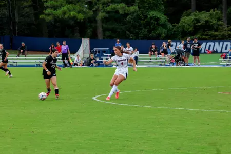 A Spiders player passes the ball upfield
