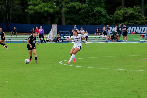 A Spiders player passes the ball upfield