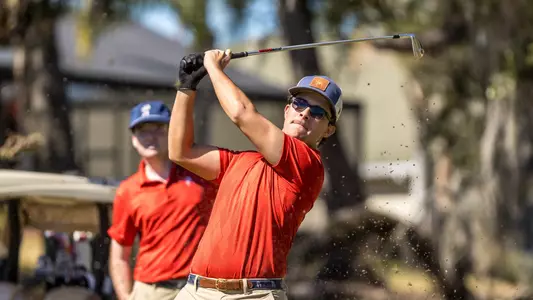 Carson Baez watches his tee shot from the tee box