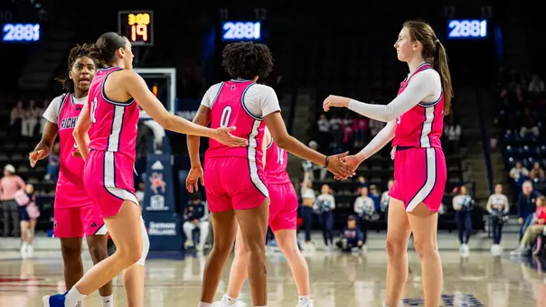 Maggie Doogan high-fiving Tierra Simon