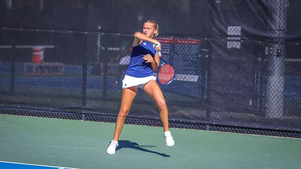 Lainey O'Neil returning a ball