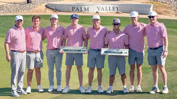 Members of the men's golf team pose after winning the Loyola Intercollegiate