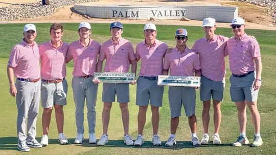 Members of the men's golf team pose after winning the Loyola Intercollegiate
