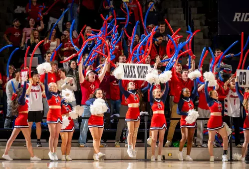 Cheerleaders and fans yell at the Robins Center