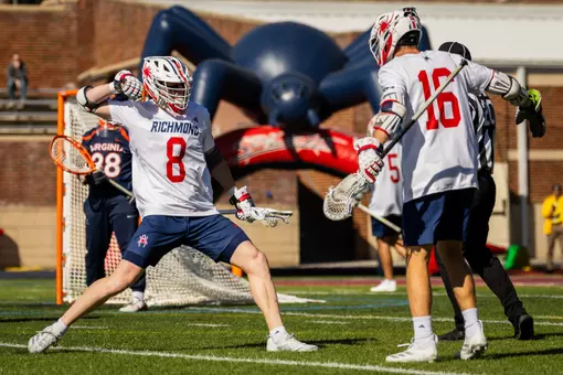 Charlie Packard and Jack Ricciardi celebrate a goal against Virginia on Feb. 14, 2026