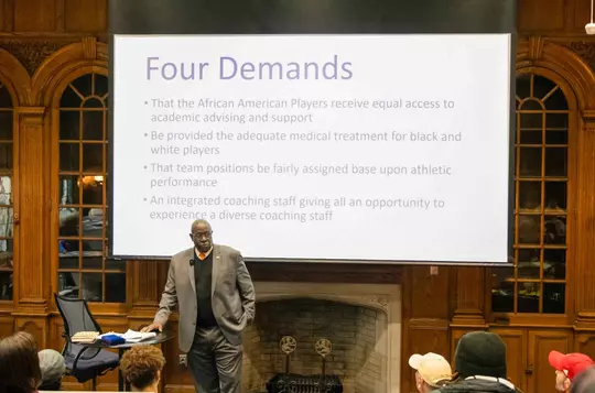 Bucky McGill speaking to group about the four demands by the Syracuse 8