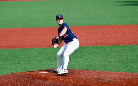 Glenn Smith strides towards home plate to pitch the ball