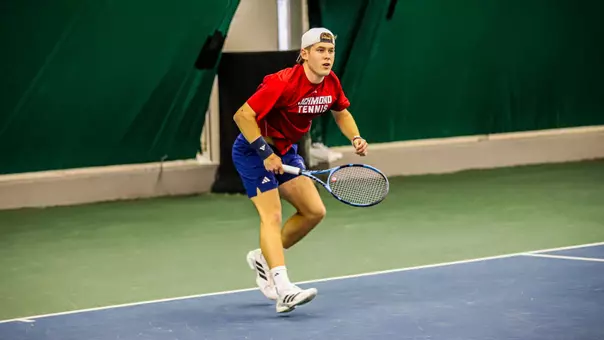 Charlie Burdell in a singles match