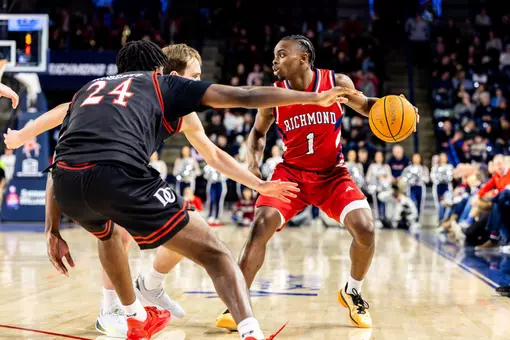 Mikkel Tyne retreats vs two defenders