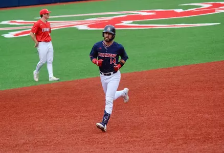 Ryan Recio trots around the bases after a home run against Cornell