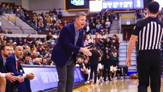 Chris Mooney talks to an official from the bench