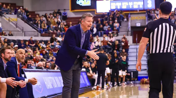 Chris Mooney talks to an official from the bench