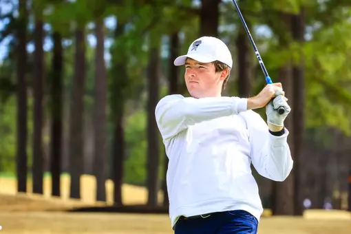 Quin Polin studies his approach shot