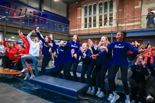 Members of the women's basketball team react to their name being called during the NCAA Selection Show