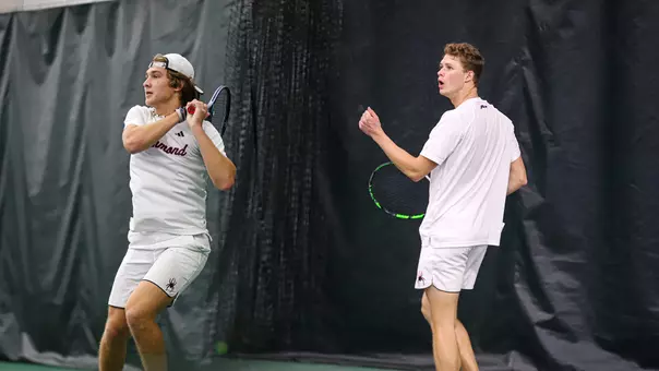 Photo of Nathan Germino and Davis wiley in a tennis match
