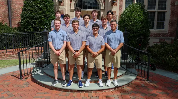 The 2025-26 men's golf team gathers on a staircase for a team photo
