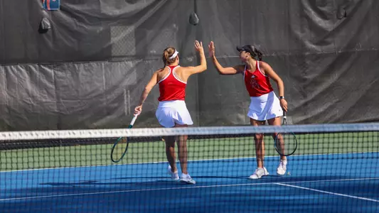 Novak and Guerra in doubles play