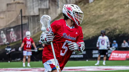 Aidan O'Neil carries the ball against UMass on March 21, 2026