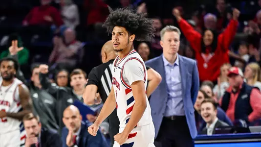 Aiden Argabright reacts after hitting a three-point shot