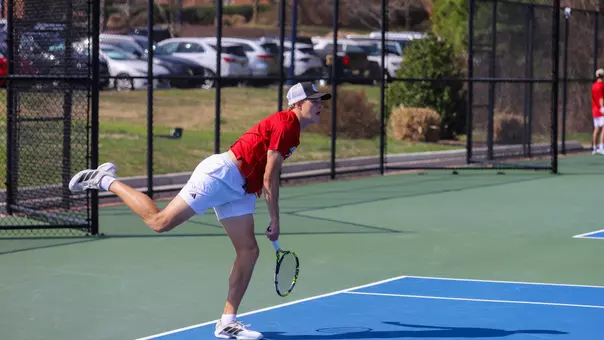 A photo of Davis Wiley after serving the ball