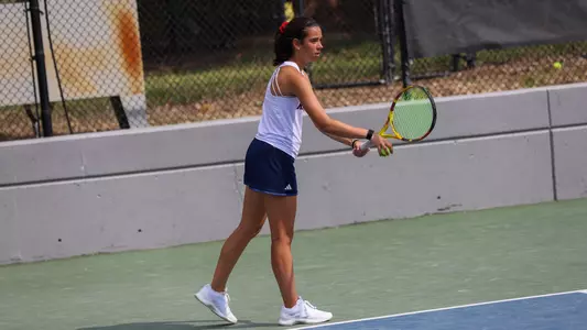 Abby Lee serving the ball vs VCU