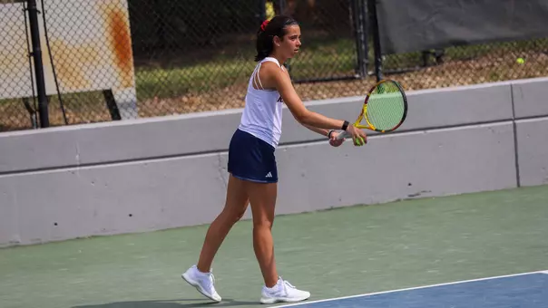 Abby Lee serving the ball vs VCU