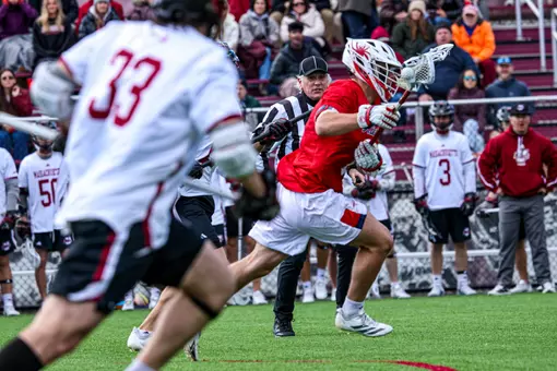 Vincent Gaylord wins a faceoff against UMass