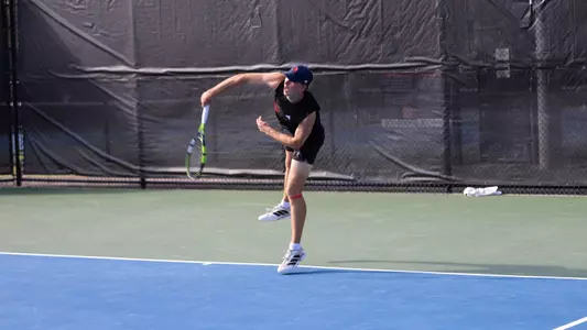 Wiley serving the ball vs UNCG